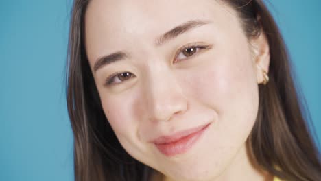 Close-up-portrait-of-beautiful-asian-young-woman-with-happy-and-smooth-face.